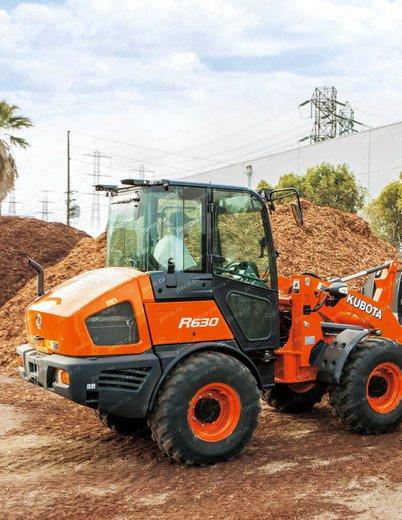 Фронтальный погрузчик KUBOTA R630Z — колесный погрузчик мини, фото производителя — фото 2 из 8 Фронтальный погрузчик KUBOTA R630Z — колесный погрузчик мини, фото производителя — фото 2 из 8